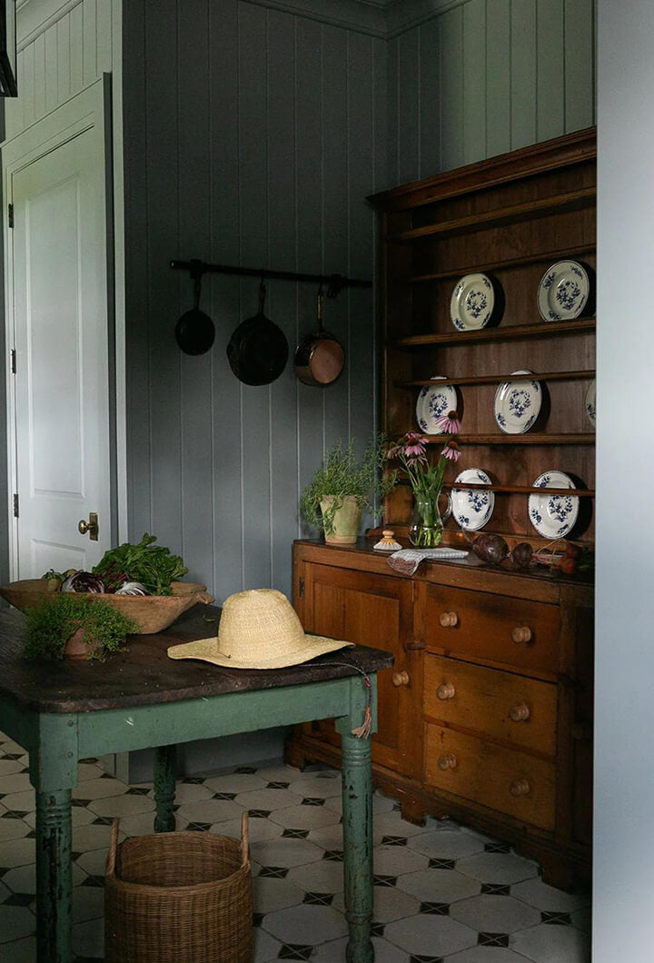 Rustic kitchen with a wooden hutch and farmhouse table